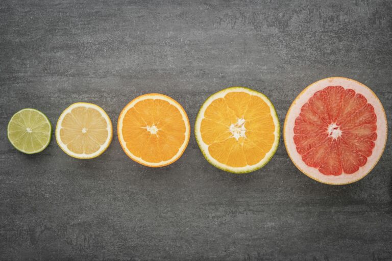 Top-down arrangement of citrus halves forming a structured gradient symbolising coherence across diverse brand elements.